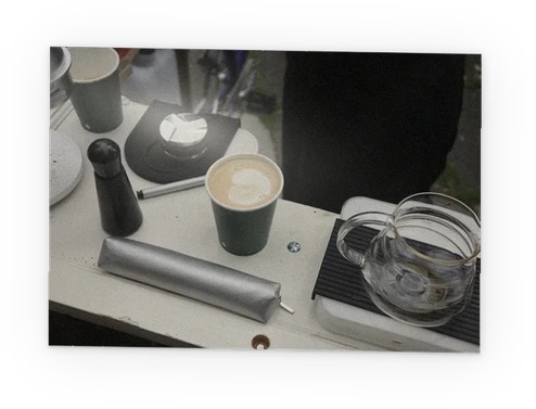 A flat white on ELLA’s white door counter